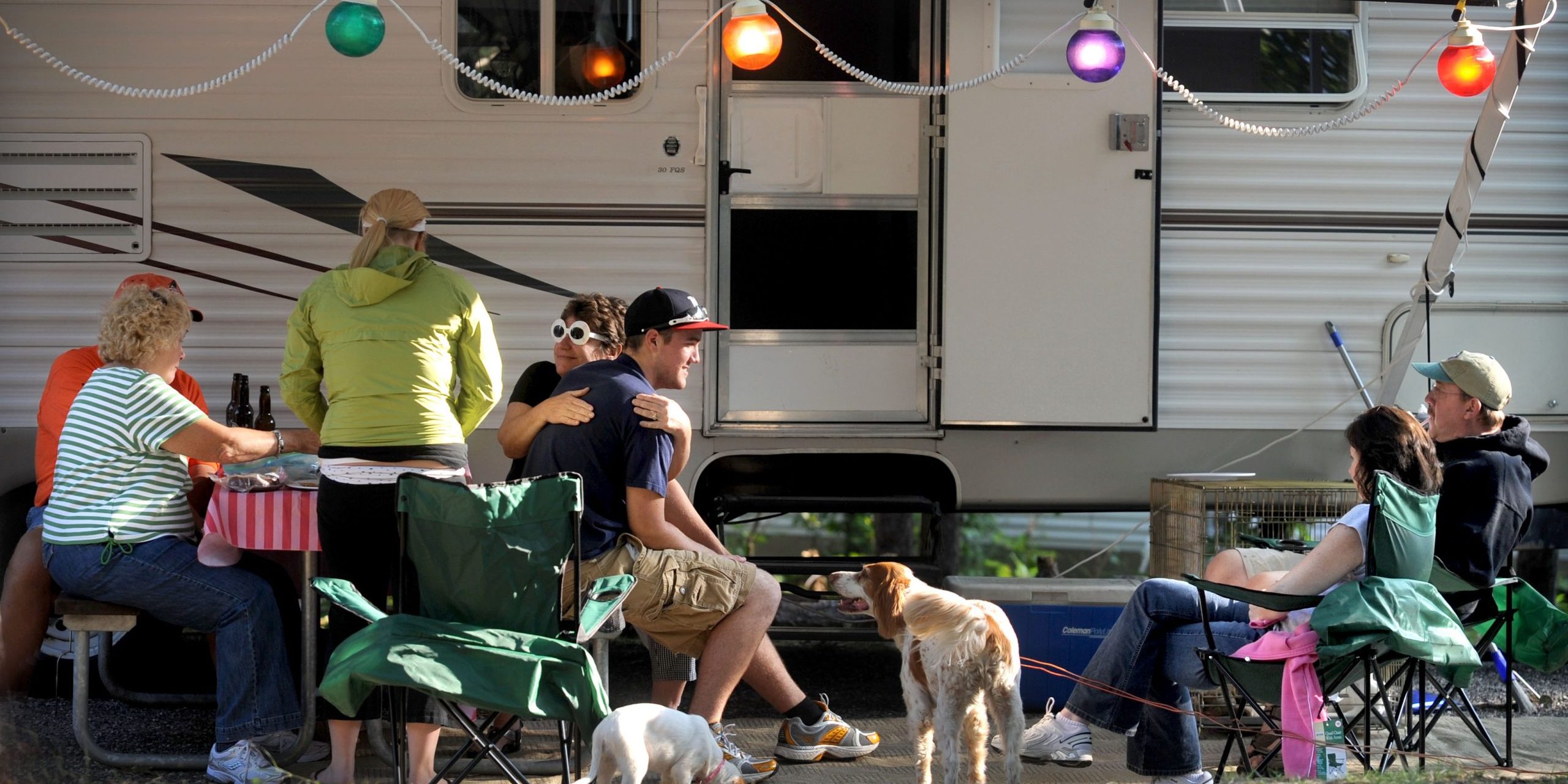 Families relaxing together at an RV campsite at White River Campground in West Michigan