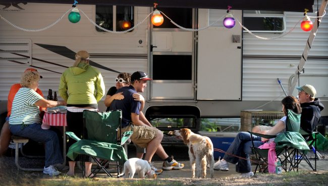 Family Camping at White River Campground in West Michigan Families relaxing together at an RV campsite at White River Campground in West Michigan