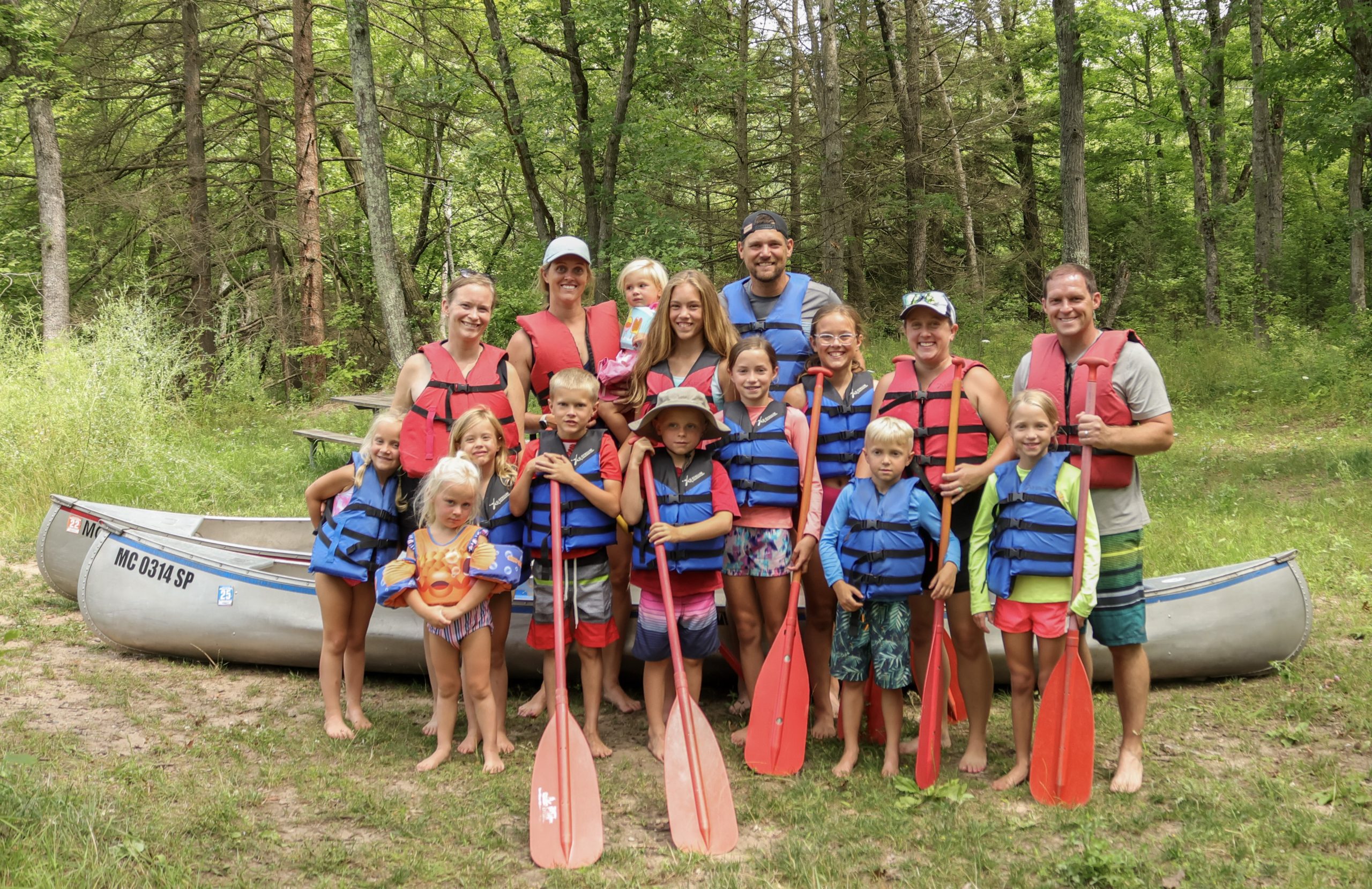 Families preparing for a canoe trip with Happy Mohawk Canoe Livery near White River RV Park & Campground in West Michigan