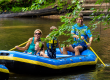 Family enjoying a rafting trip on the White River near White River RV Park & Campground in West Michigan