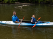 Father and son kayaking on the White River near White River RV Park & Campground in West Michigan
