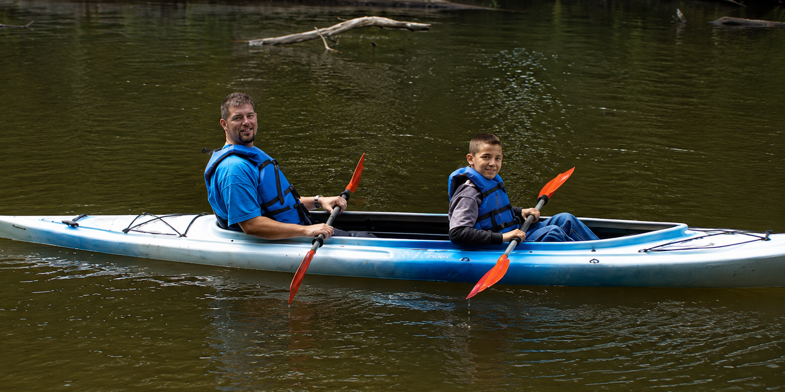 Kayaking the White River Near White River RV Park & Campground Father and son kayaking on the White River near White River RV Park & Campground in West Michigan