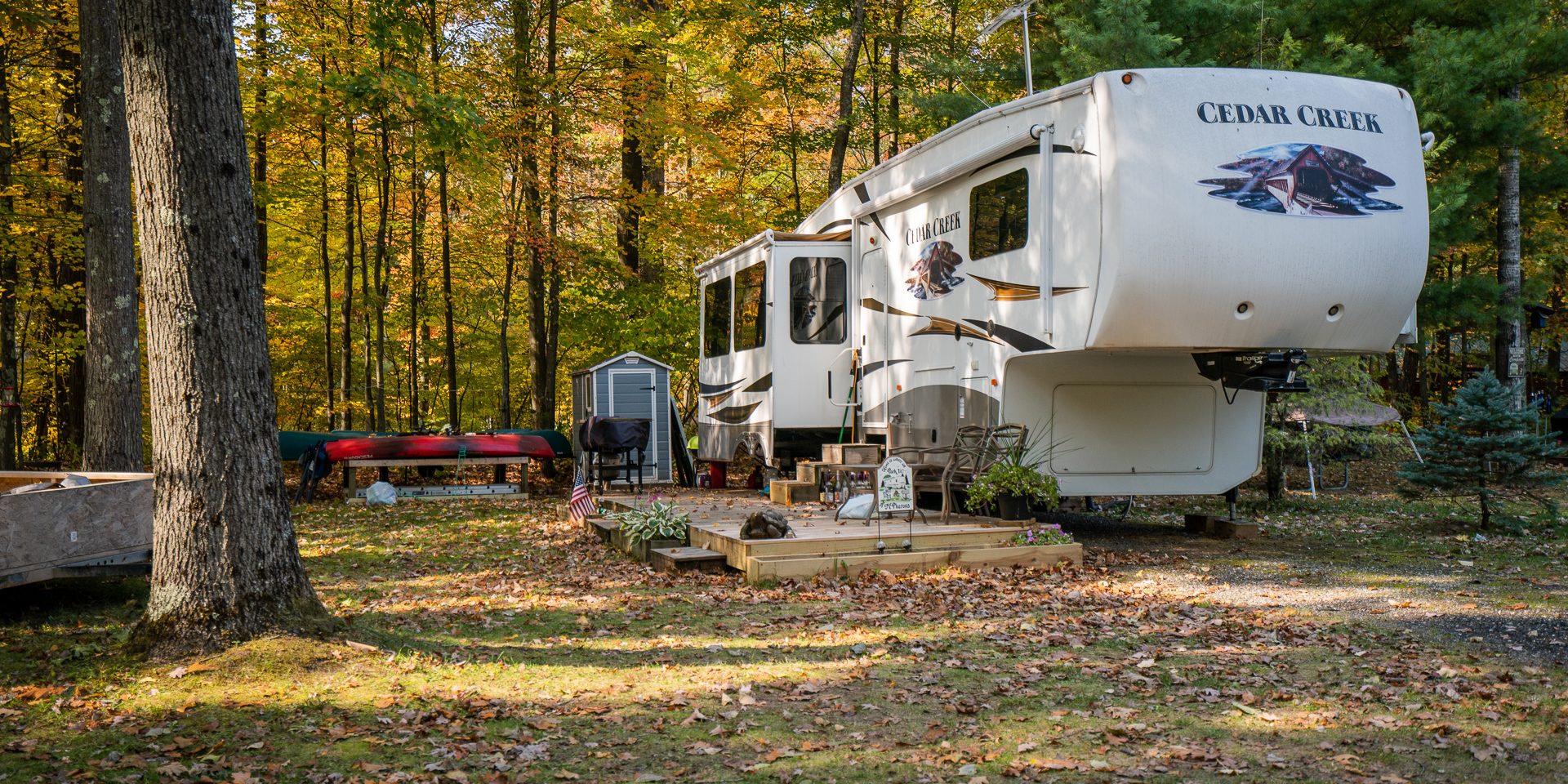 RV campsite surrounded by colorful fall foliage at White River RV Park & Campground before winter storage season