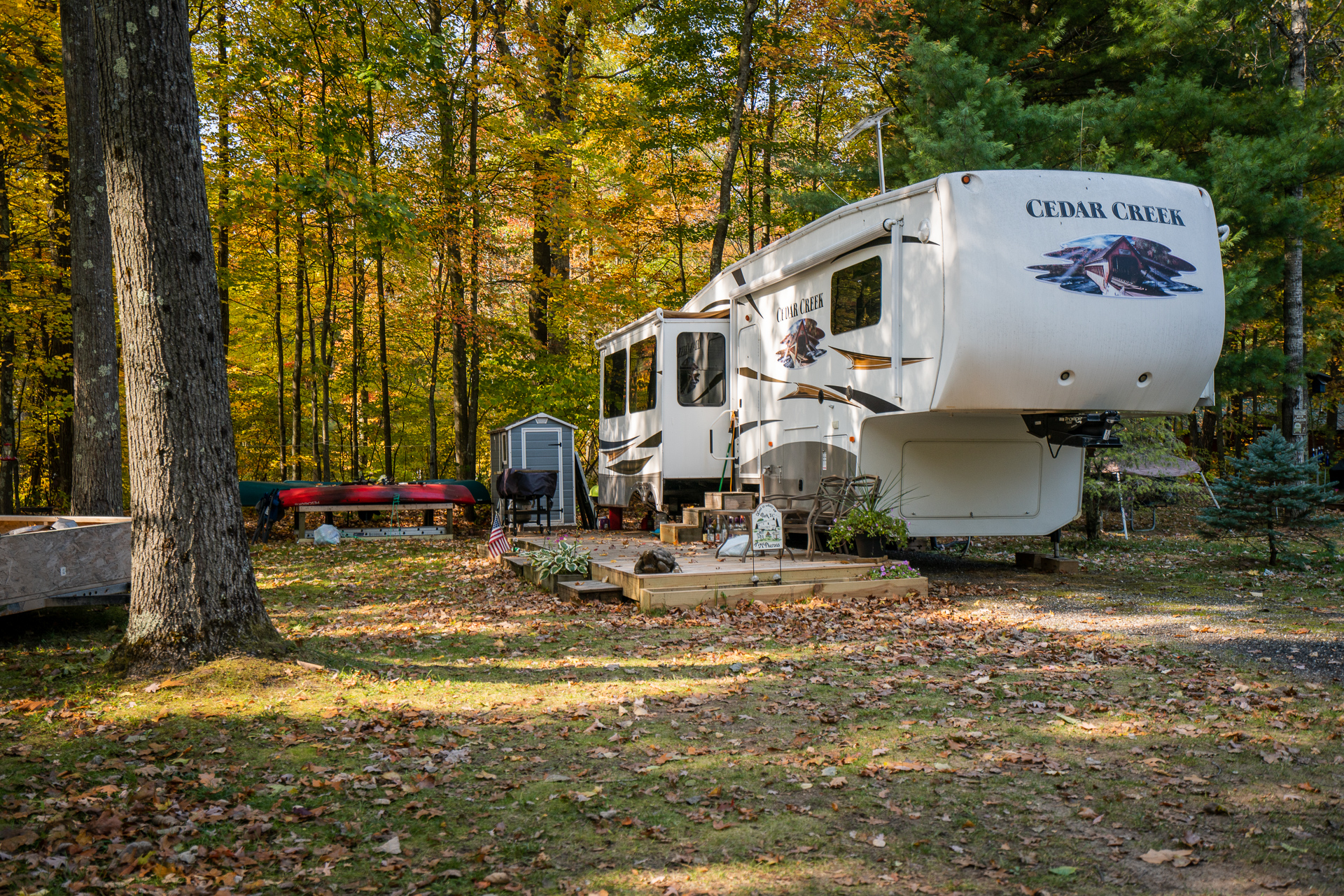 RV campsite surrounded by colorful fall foliage at White River RV Park & Campground before winter storage season